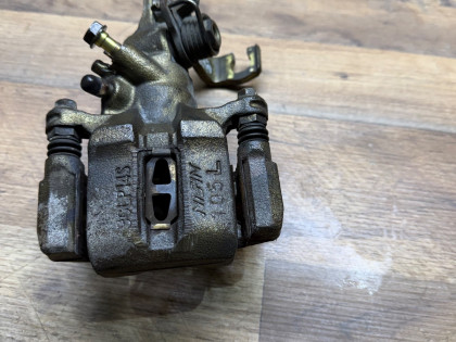 Суппорт задний левый